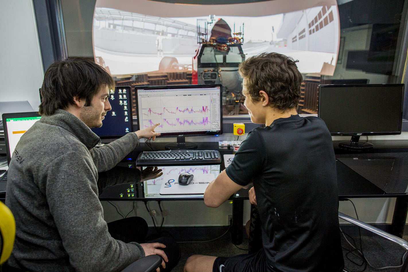 professional racing simulator analytics lando norris training on f1 professional simulator