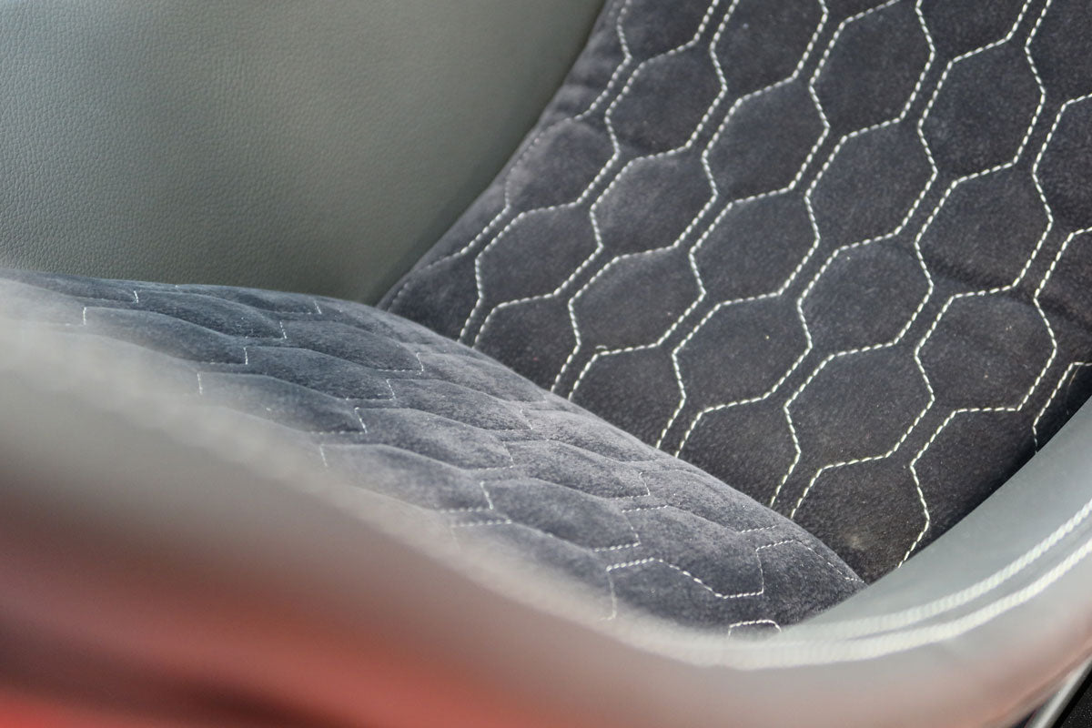 custom stitched alcantara and leather seating for the formula pro racing simulator made by cool performance