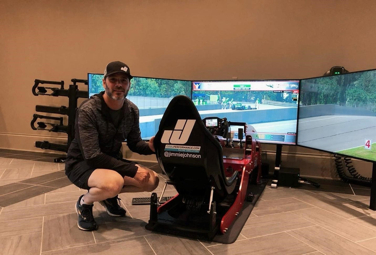 Jimmie Johnson beside his Cool Performance Formula Pro simulator