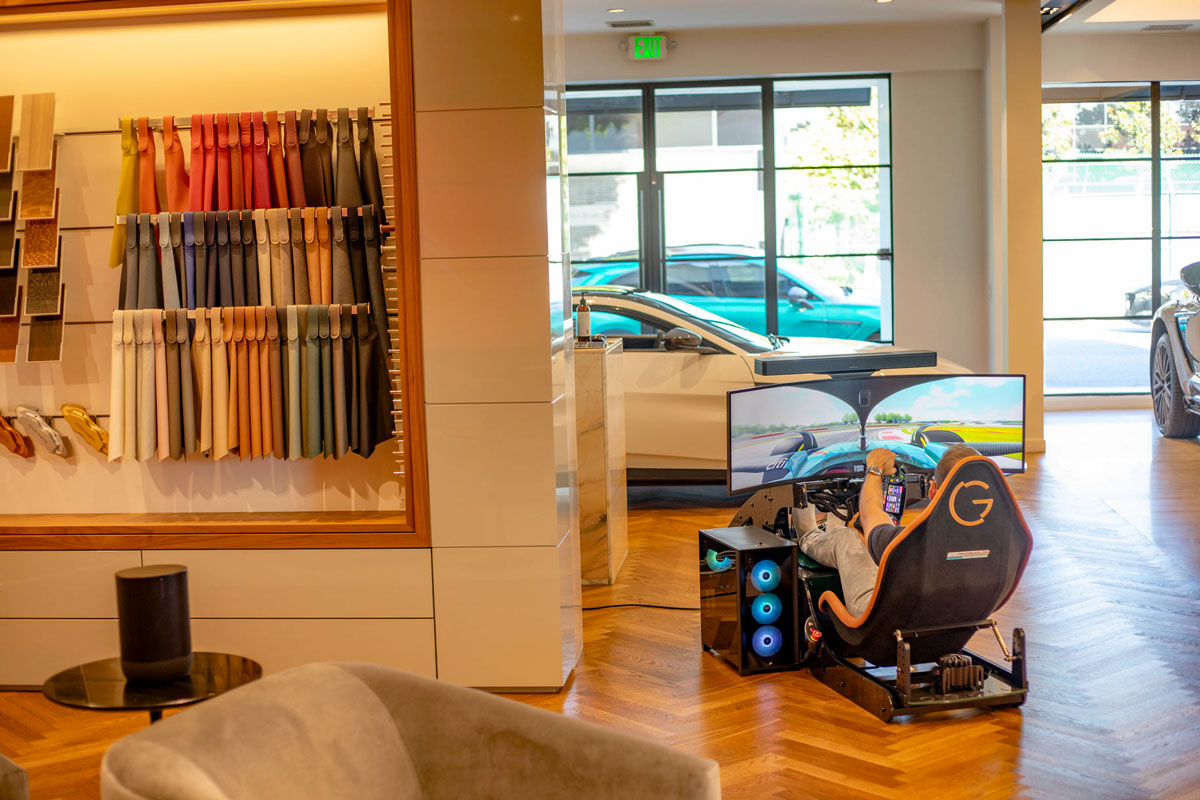 Ogara aston martin las vegas showroom with a cool performance f1 racing simulator formula pro