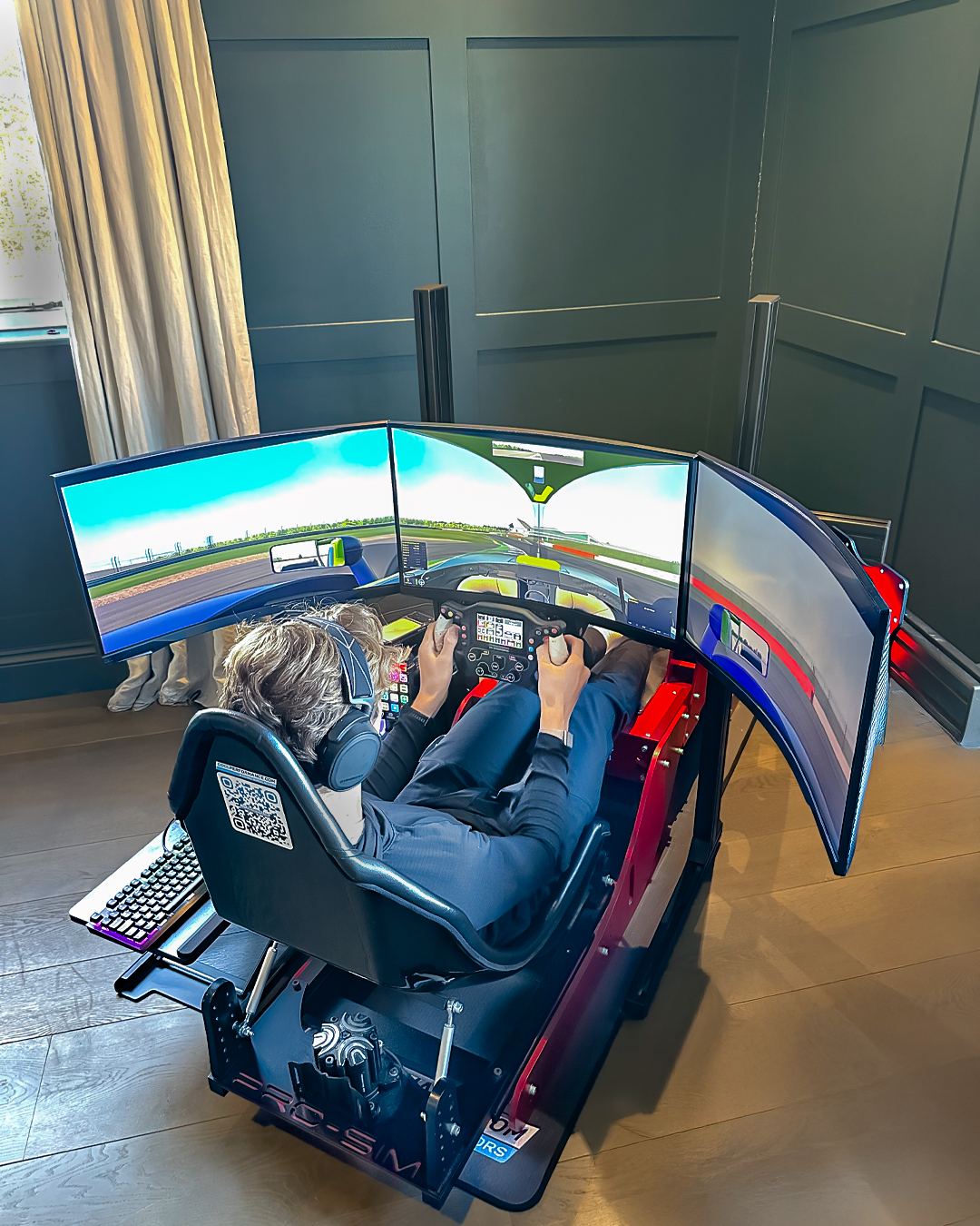 Noah Lisle in his Cool Performance Formula Pro simulator with triple screens