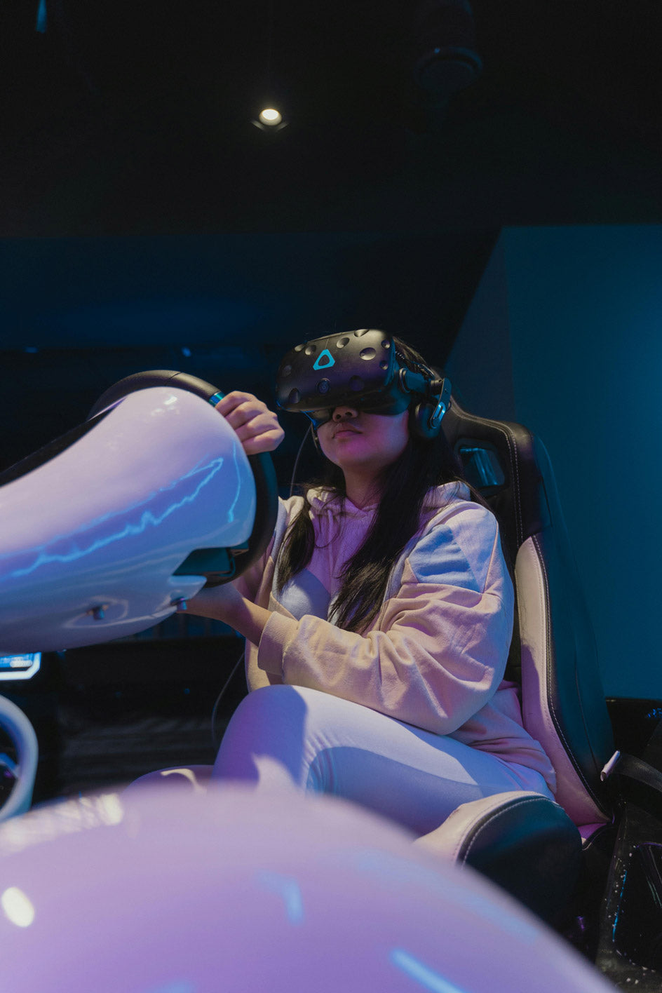Person using virtual reality on a racing simulator