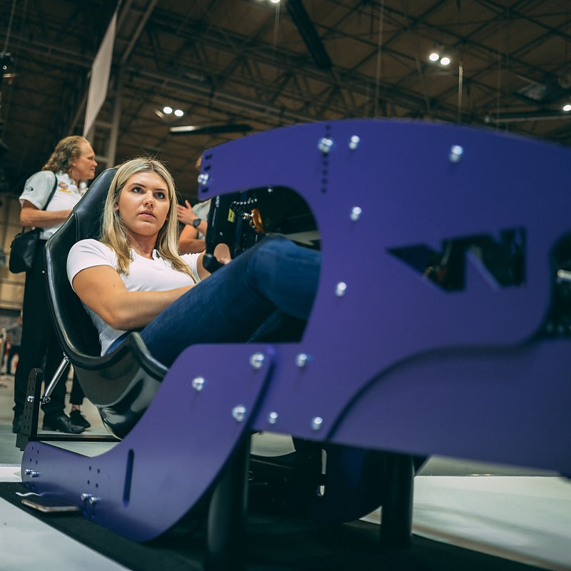Custom colour purple vinyl wrap on racing simulator for use at public show