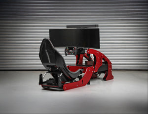 Formula Pro F1 racing simulator with red frame and centre-mounted monitor