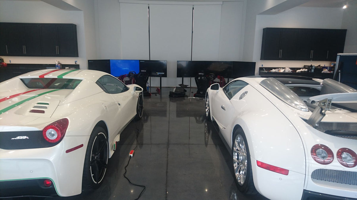 Ian Poulter's garage with Cool Performance GT Pro simulators behind his cars