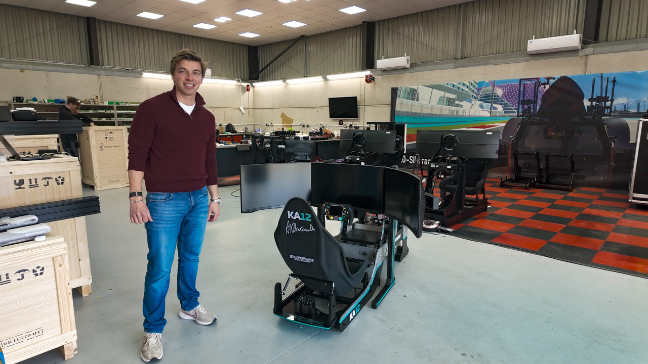 Cool Performance founder Oliver Norris next to Kimi Antonelli's Formula Pro KA12 edition simulator