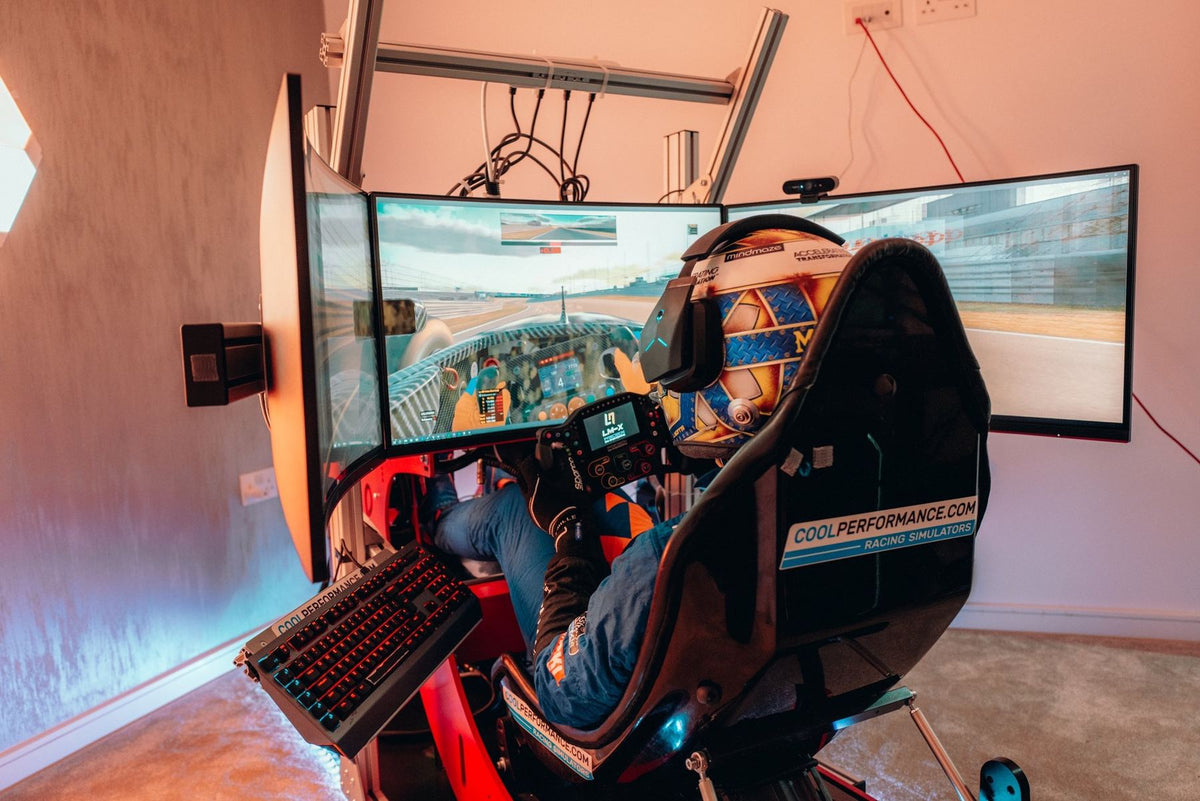 Lando Norris driving his Cool Performance Formula Pro simulator