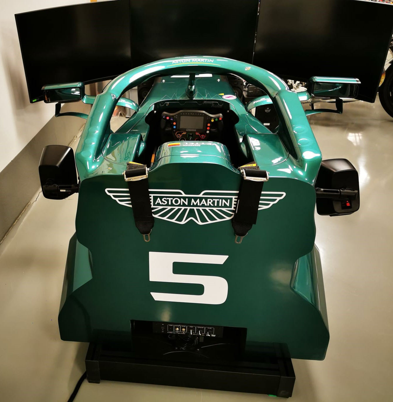 Rear view of Aston Martin F1 x Cool performance racing simulator