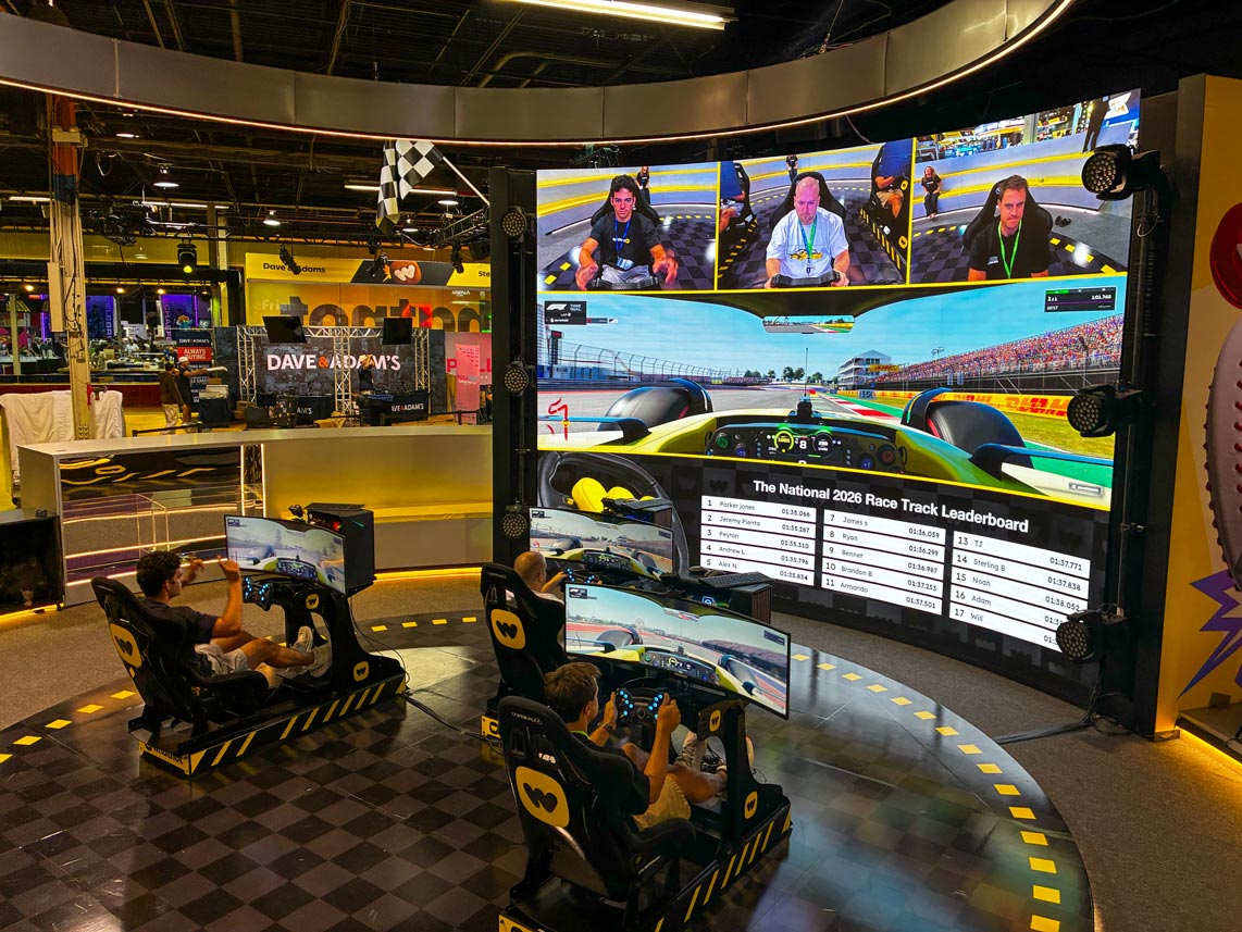 Custom branded live leaderboard and racing simulators for Whatnot at a Cool Performance racing simulator event with a complelty bespoke branded environment