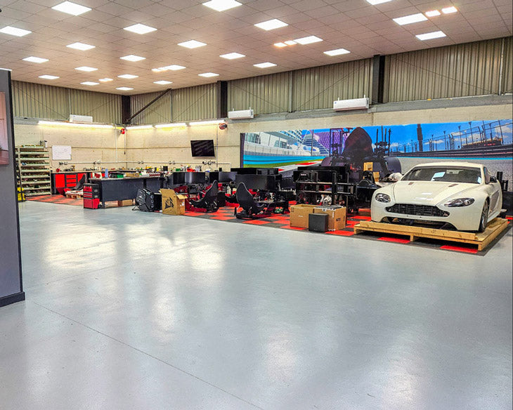 Cool Performance workshop with multiple professional racing simulators being made