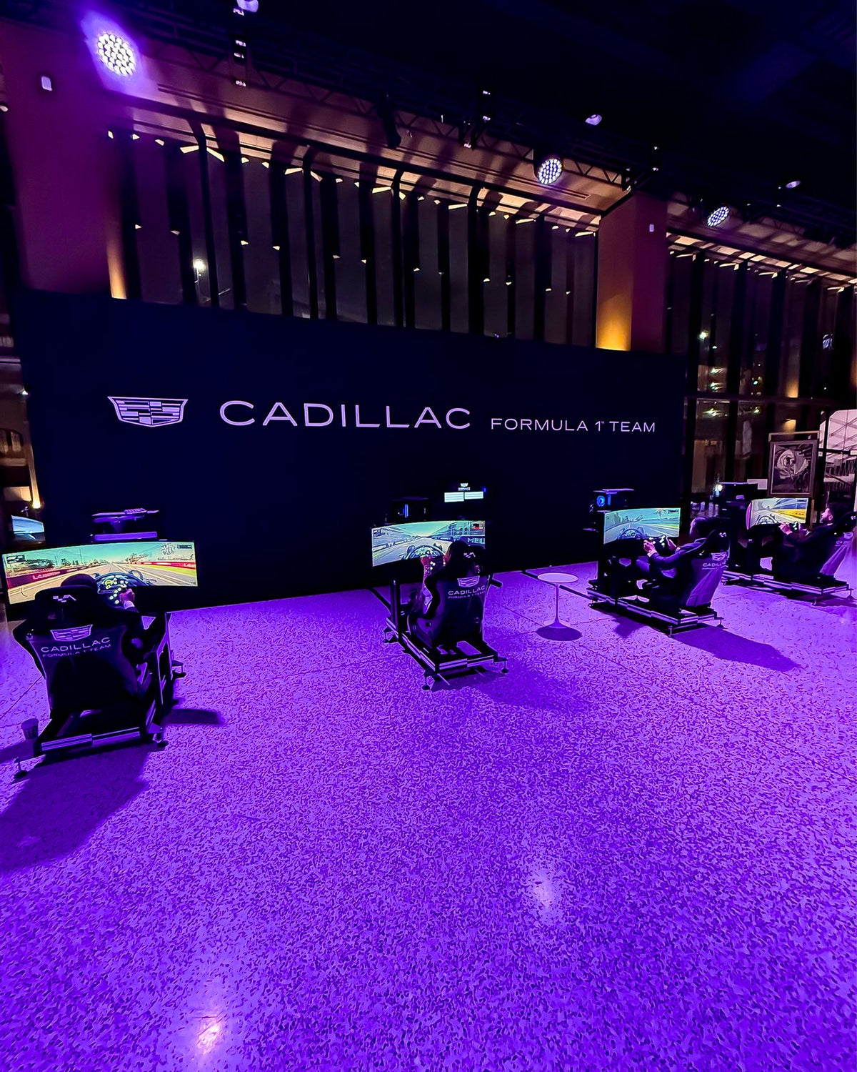Four branded F1 simulators on hire at the Cadillac Formula 1 Team booth, Detroit auto show, Michigan, USA