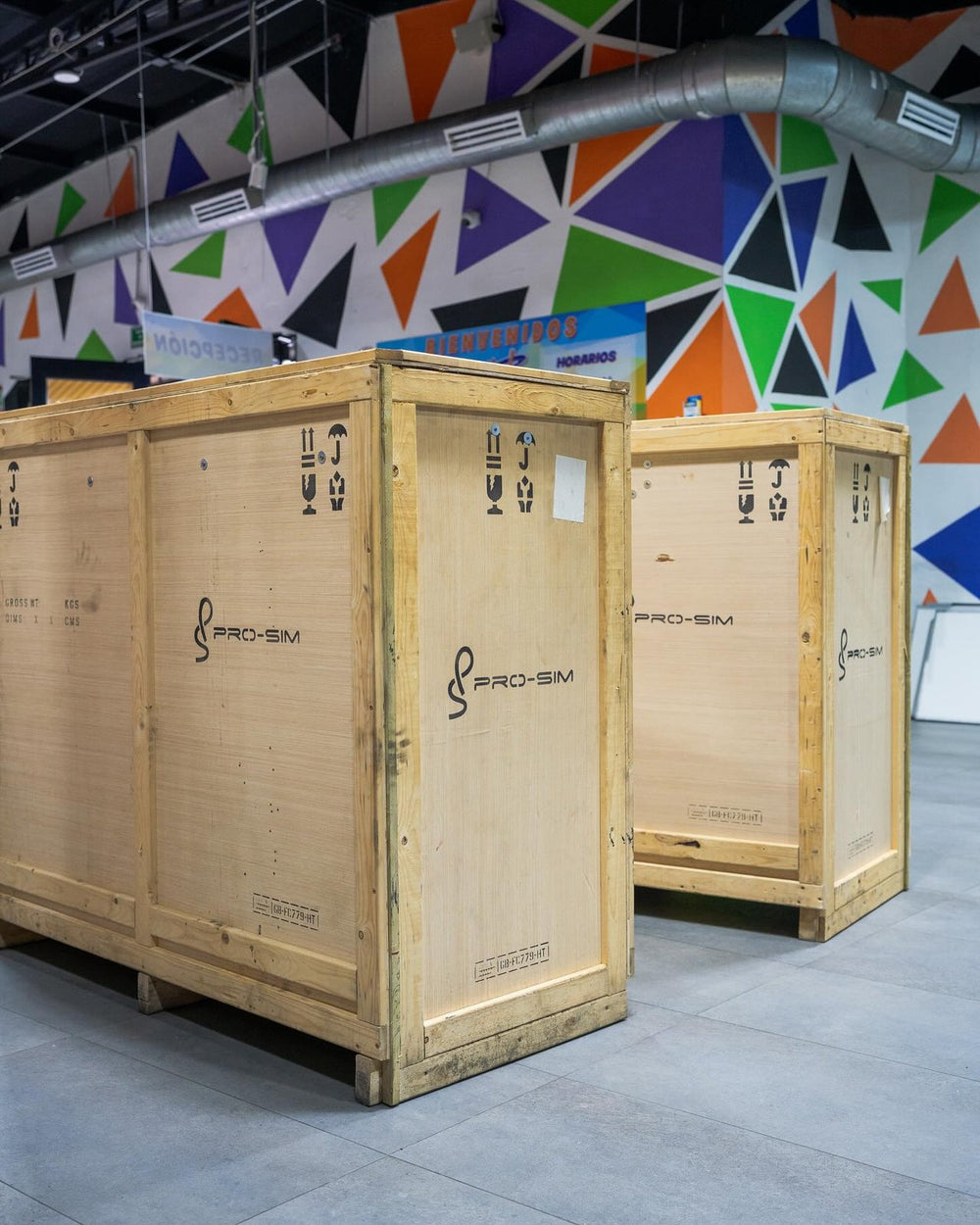 Two GT Sport simulators arriving in wooden Pro-Sim crates at Kri Kri Park, South America