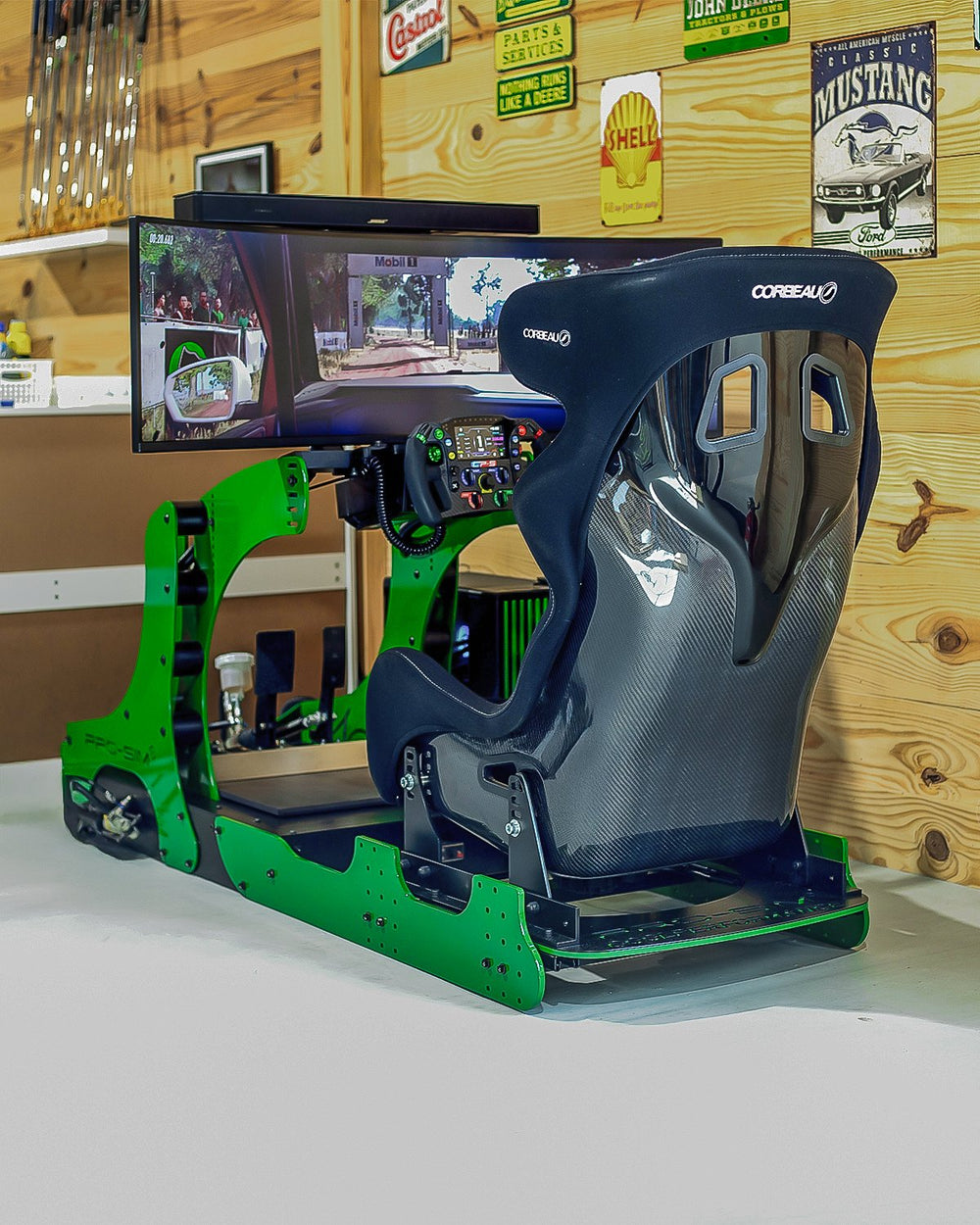 GT Pro in John Deere green with Corbeau seat in a timber clad home games room