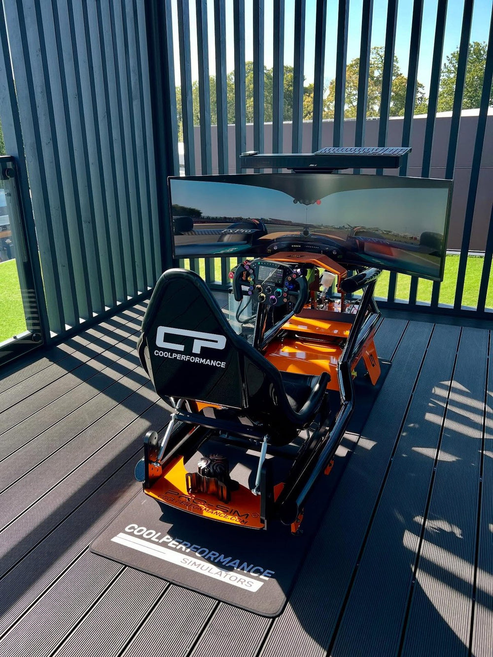 Racing simulator on the Lanzante stand at the Goodwood Festival of Speed, England, UK