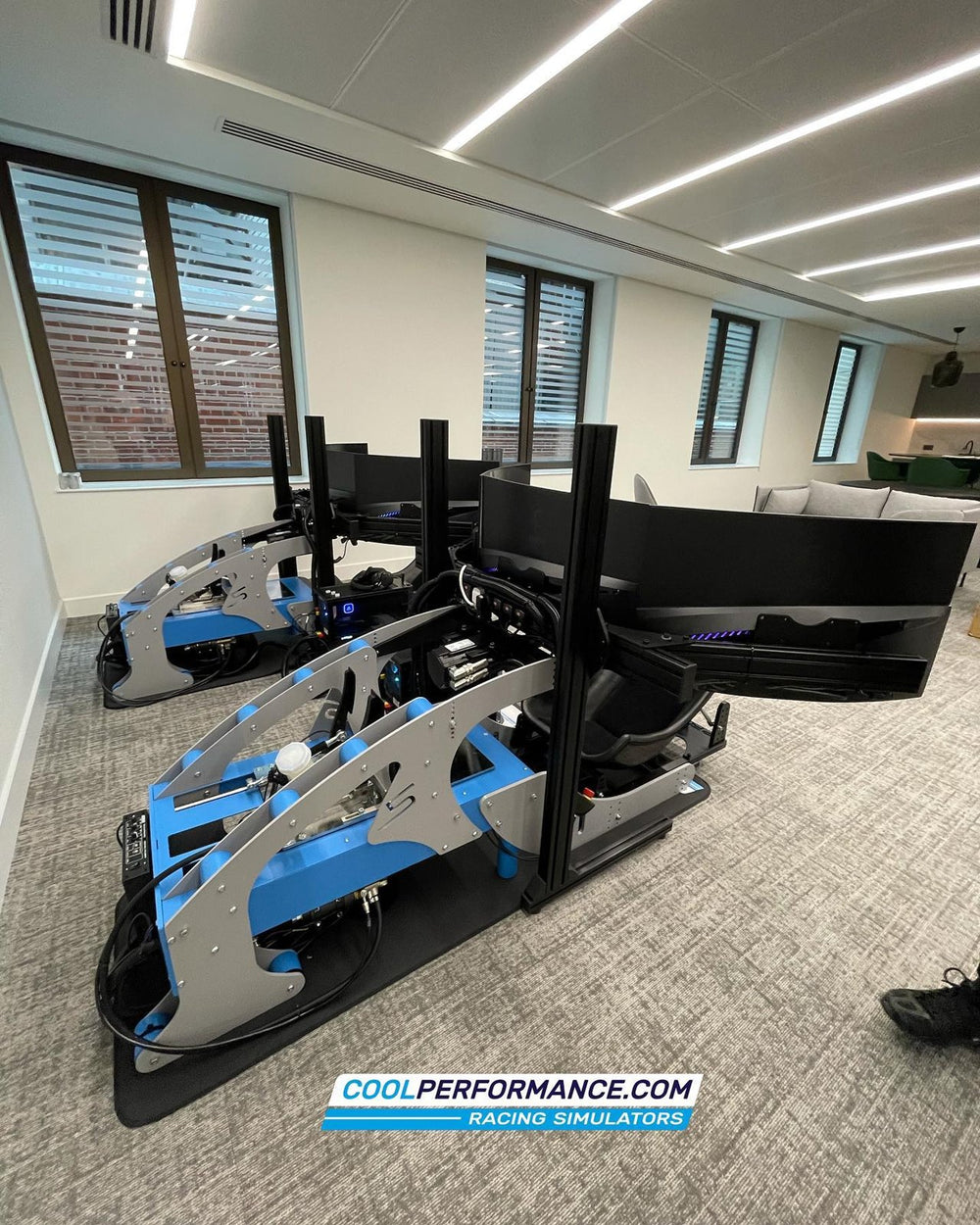 Two custom blue and silver simulators side by side in a home in Mayfair, London, UK