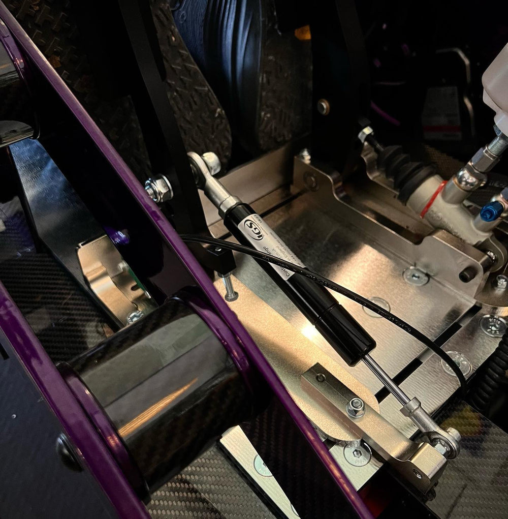 Chrome purple Formula simulator frame with carbon fibre and hydraulic pedals, built for a home