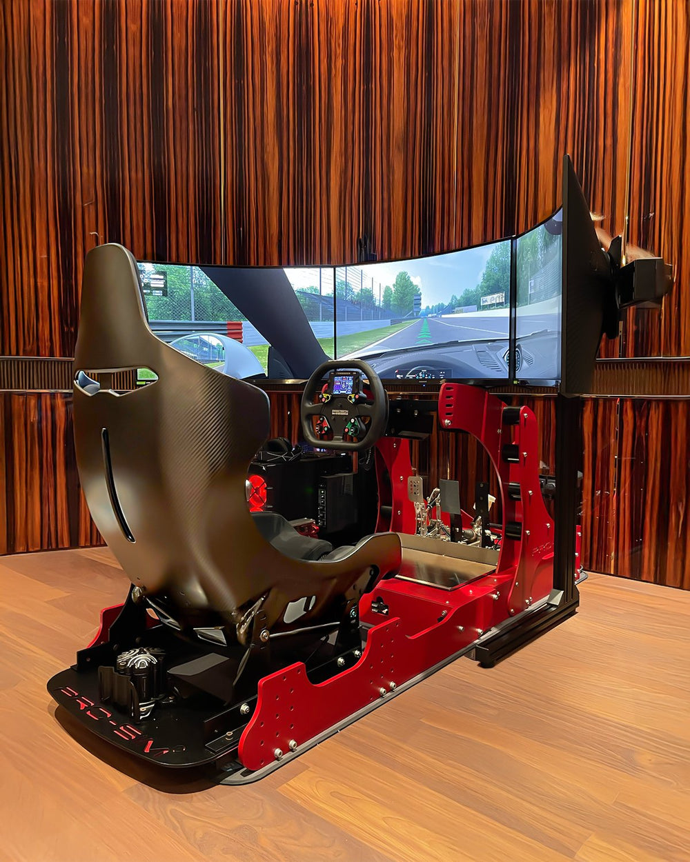 Red GT Pro with McLaren Senna carbon seat and triple curved monitor in a home